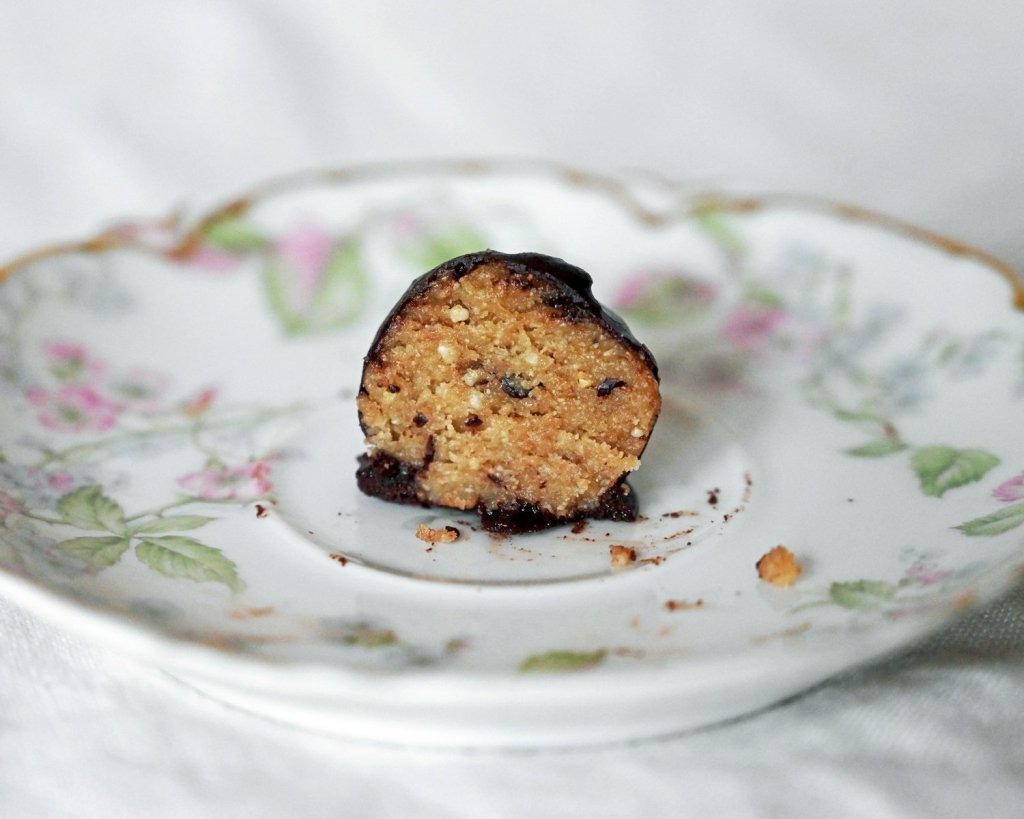 Chocolate covered gluten free and vegan no bake cookie dough bite.